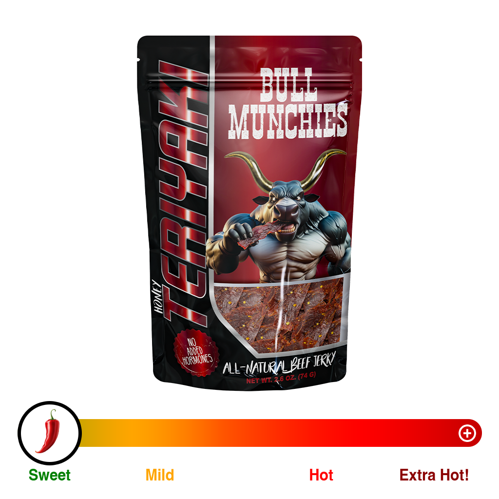 Bull Munchies Honey Teriyaki Beef Jerky packaging featuring a muscular bull character holding a piece of jerky. The package highlights ‘No Added Hormones,’ ‘All-Natural Beef Jerky,’ and ‘Net Wt. 2.6 oz (74 g).’ The jerky inside is visible in the lower part of the package.“​