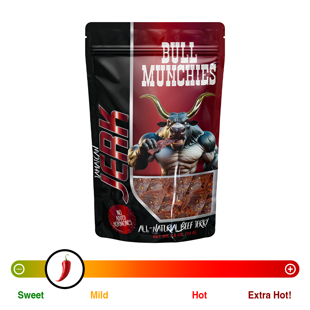 Bull Munchies Jamaican Jerk Beef Jerky packaging featuring a muscular bull character holding a piece of jerky. The package highlights ‘No Added Hormones,’ ‘All-Natural Beef Jerky,’ and ‘Net Wt. 2.6 oz (74 g).’ The jerky inside is visible in the lower part of the package.“​